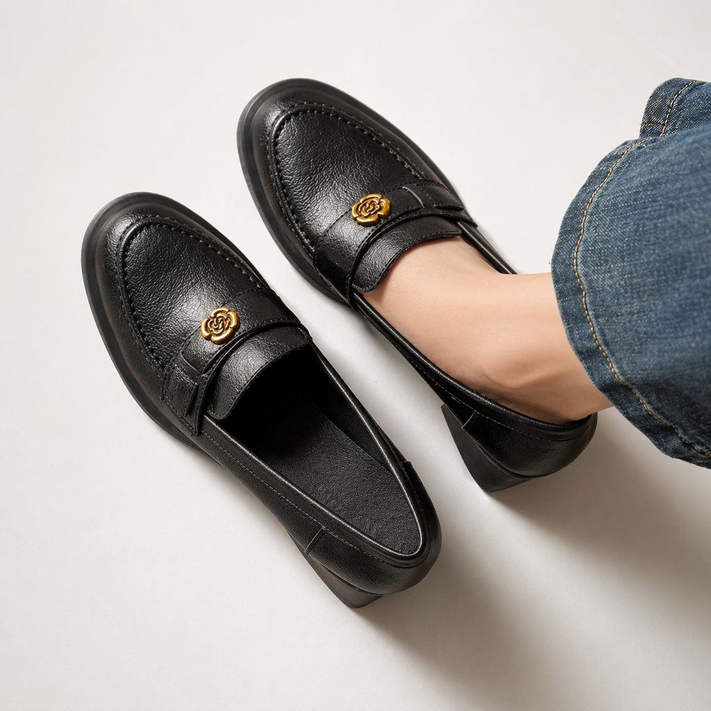 Penny loafer with heel, close-up of metal detail