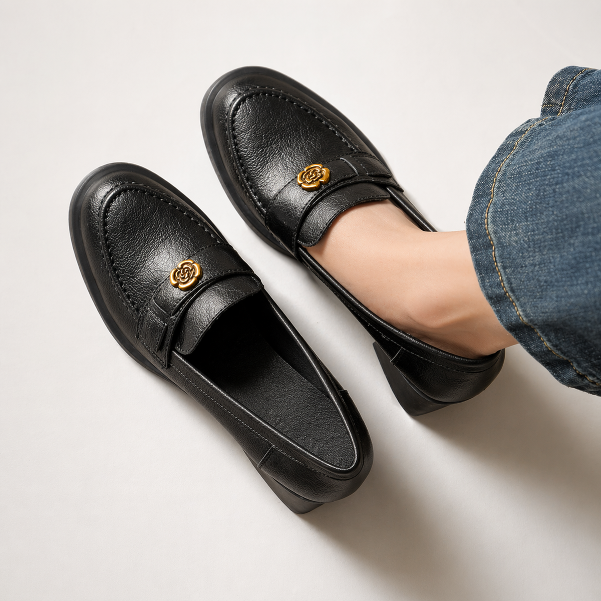 Penny loafer with heel, close-up of metal detail