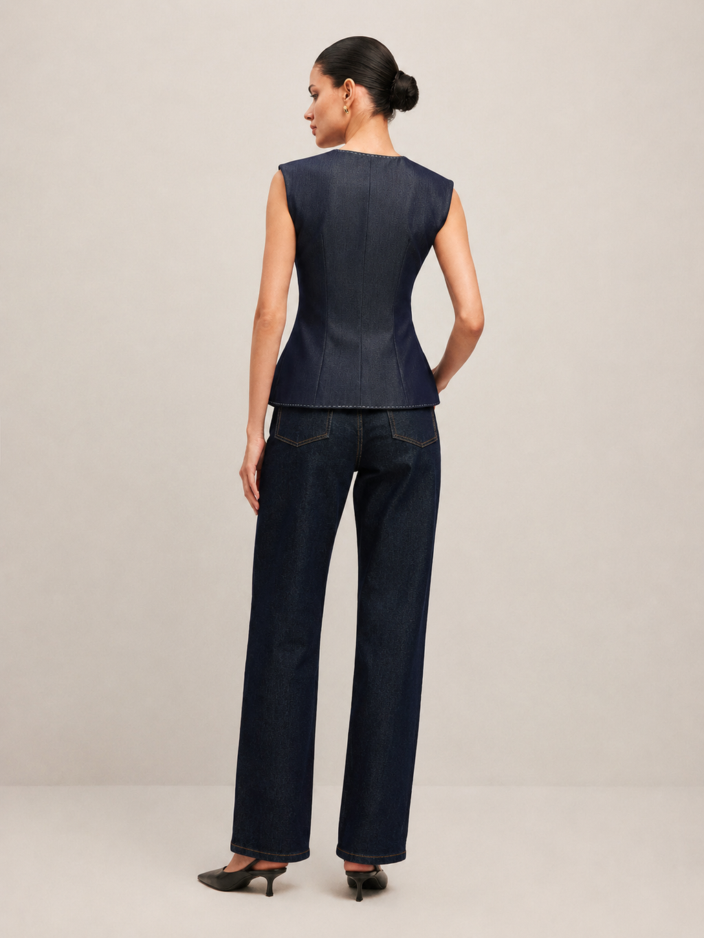 Navy peplum gilet styled with blouse