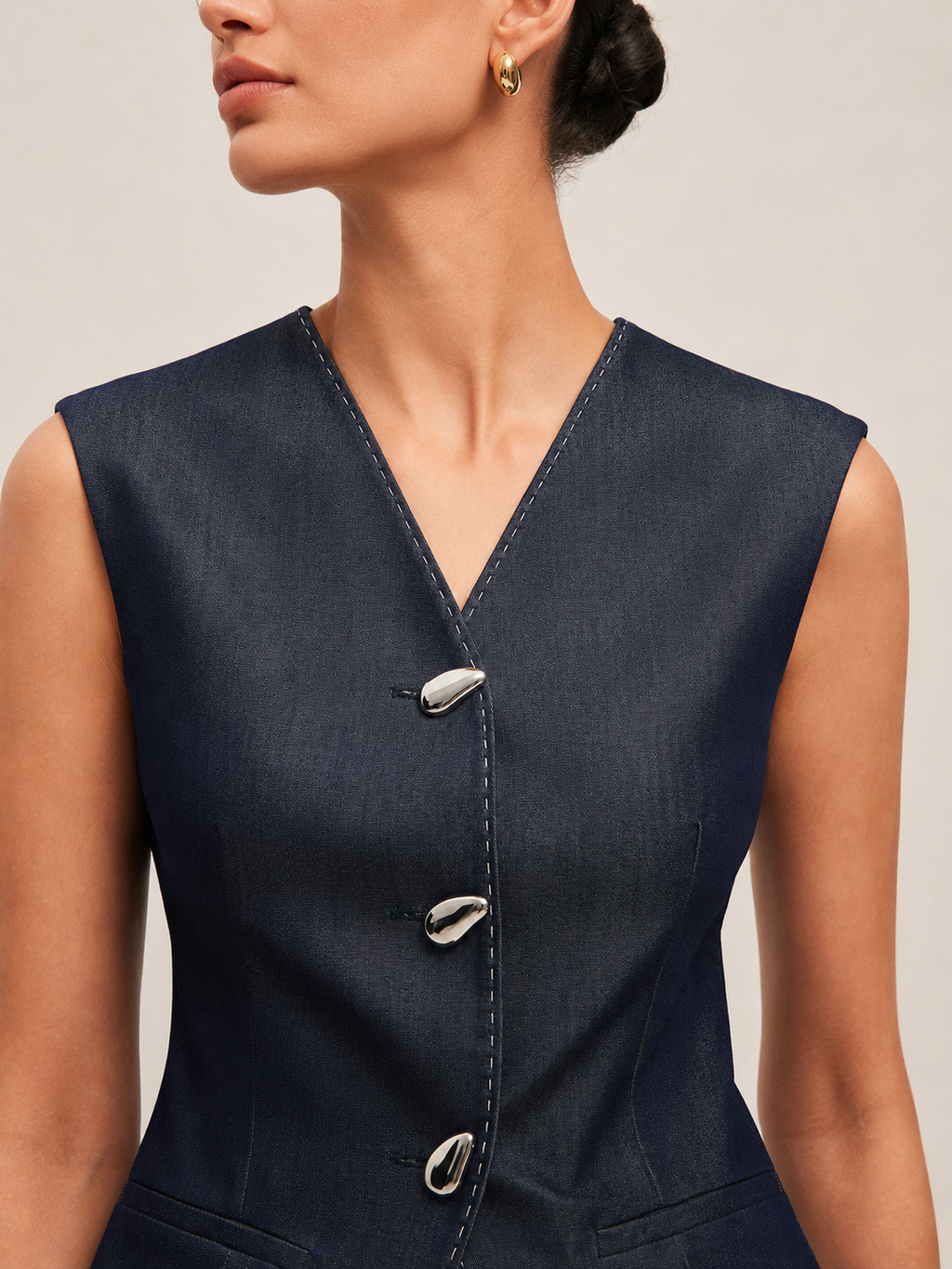 Navy peplum gilet side view