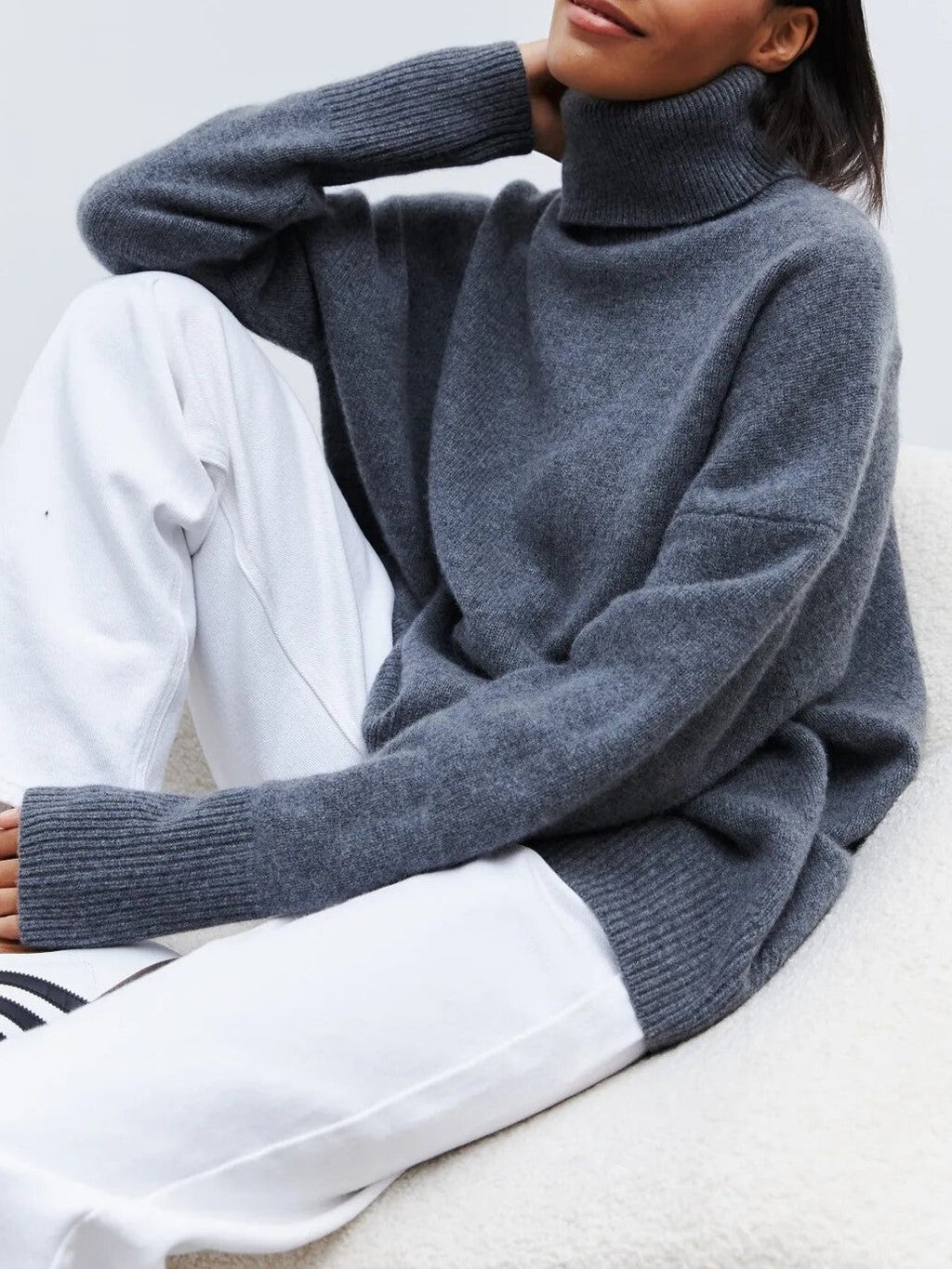 Roll neck jumper styled with jeans
