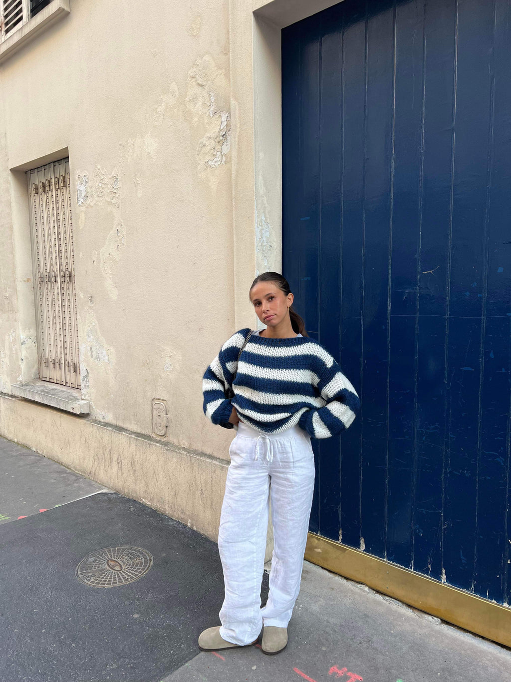 Model wearing striped jumper