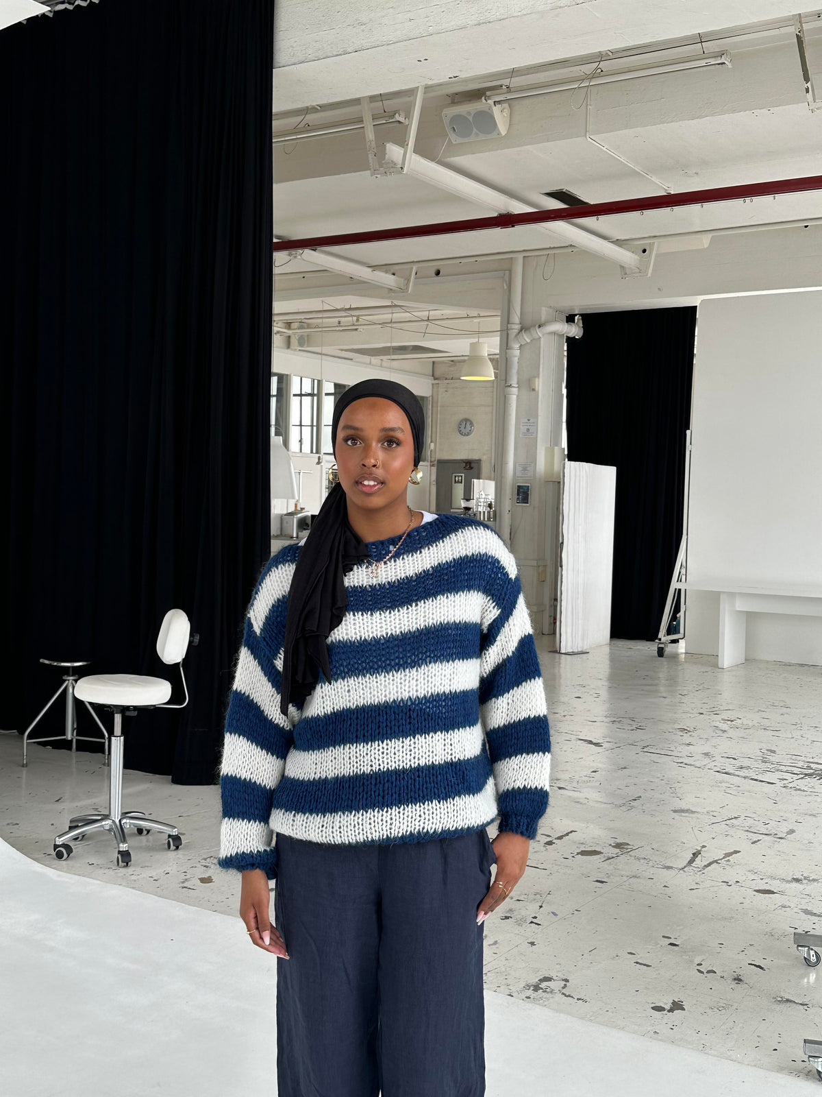 Striped jumper styled with jeans