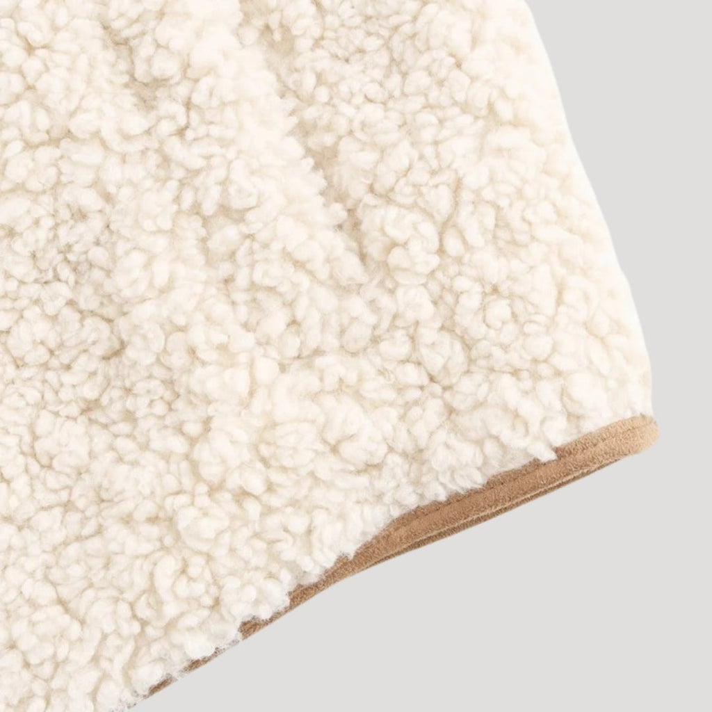 Beige tie-front vest fabric detail