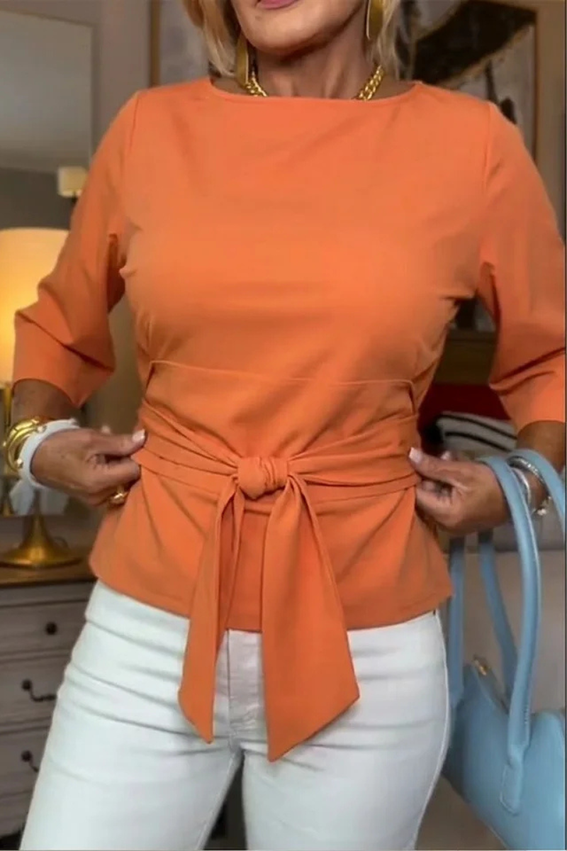 Bow waist top worn with skirt