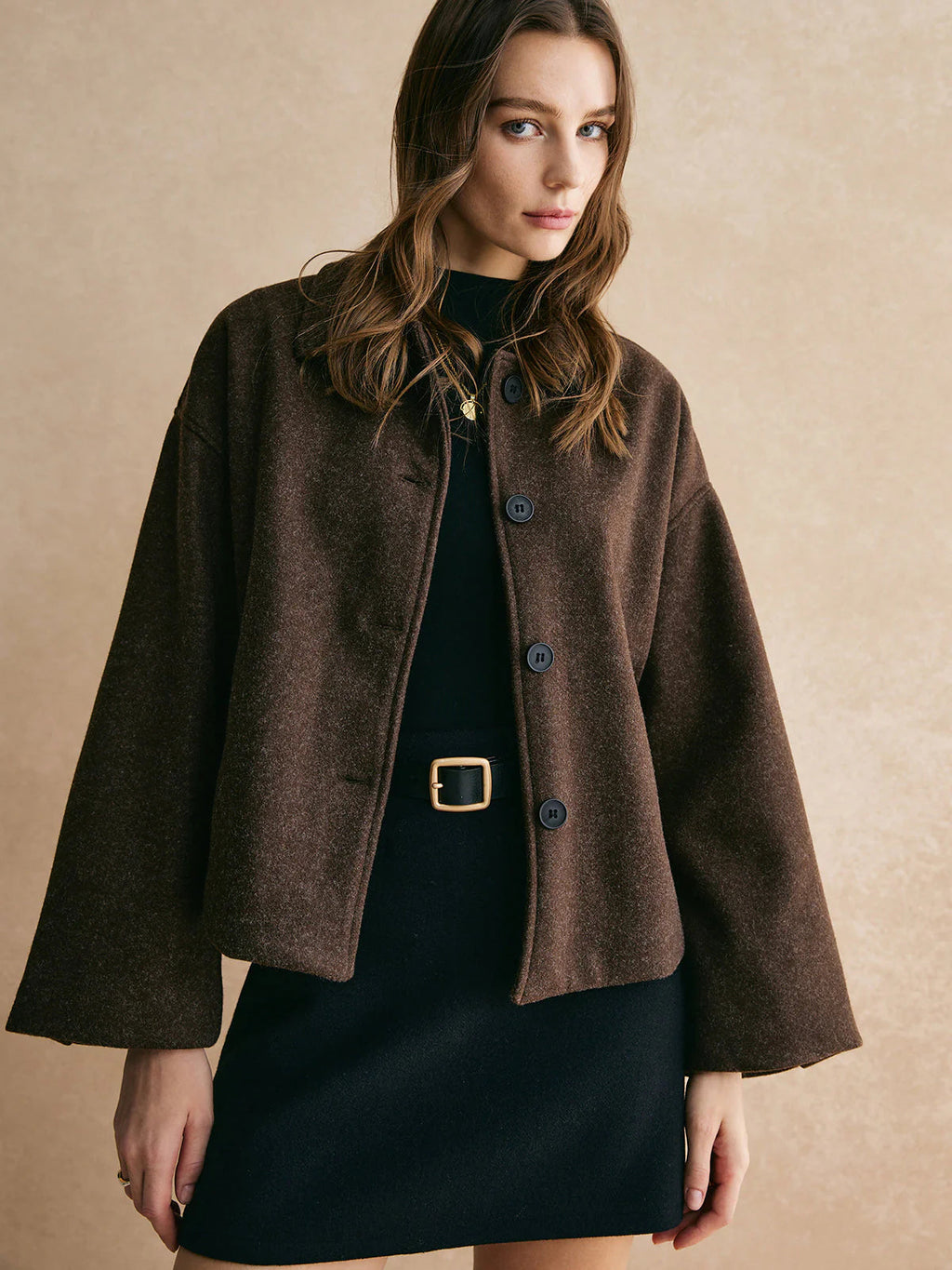 Dark brown boxy fit blazer worn with trousers