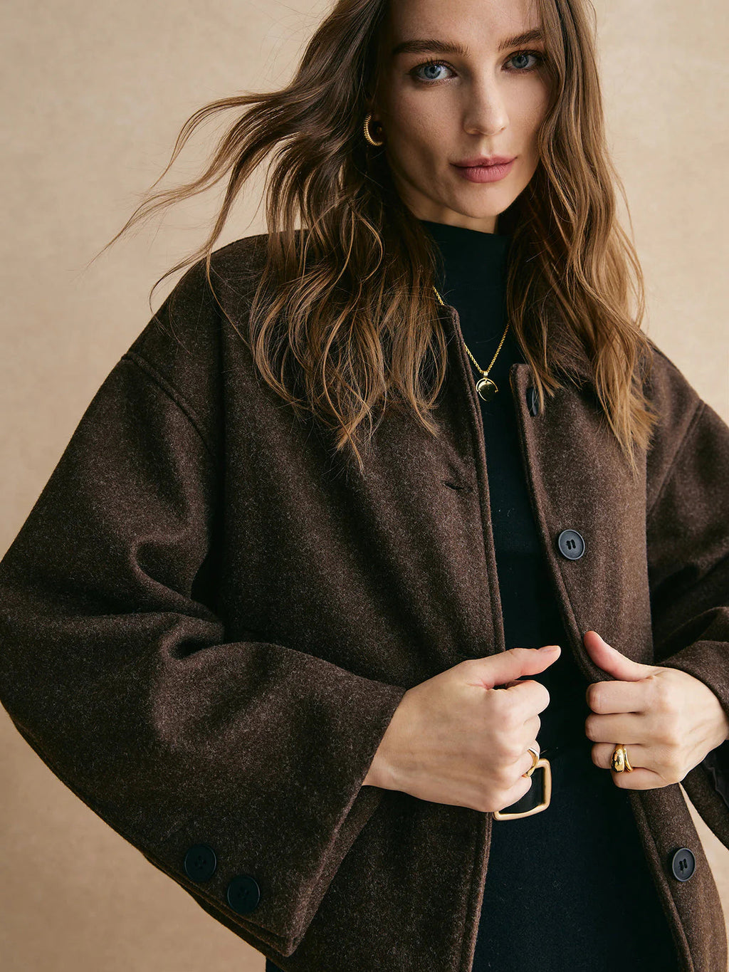 Dark brown boxy fit blazer worn with jeans