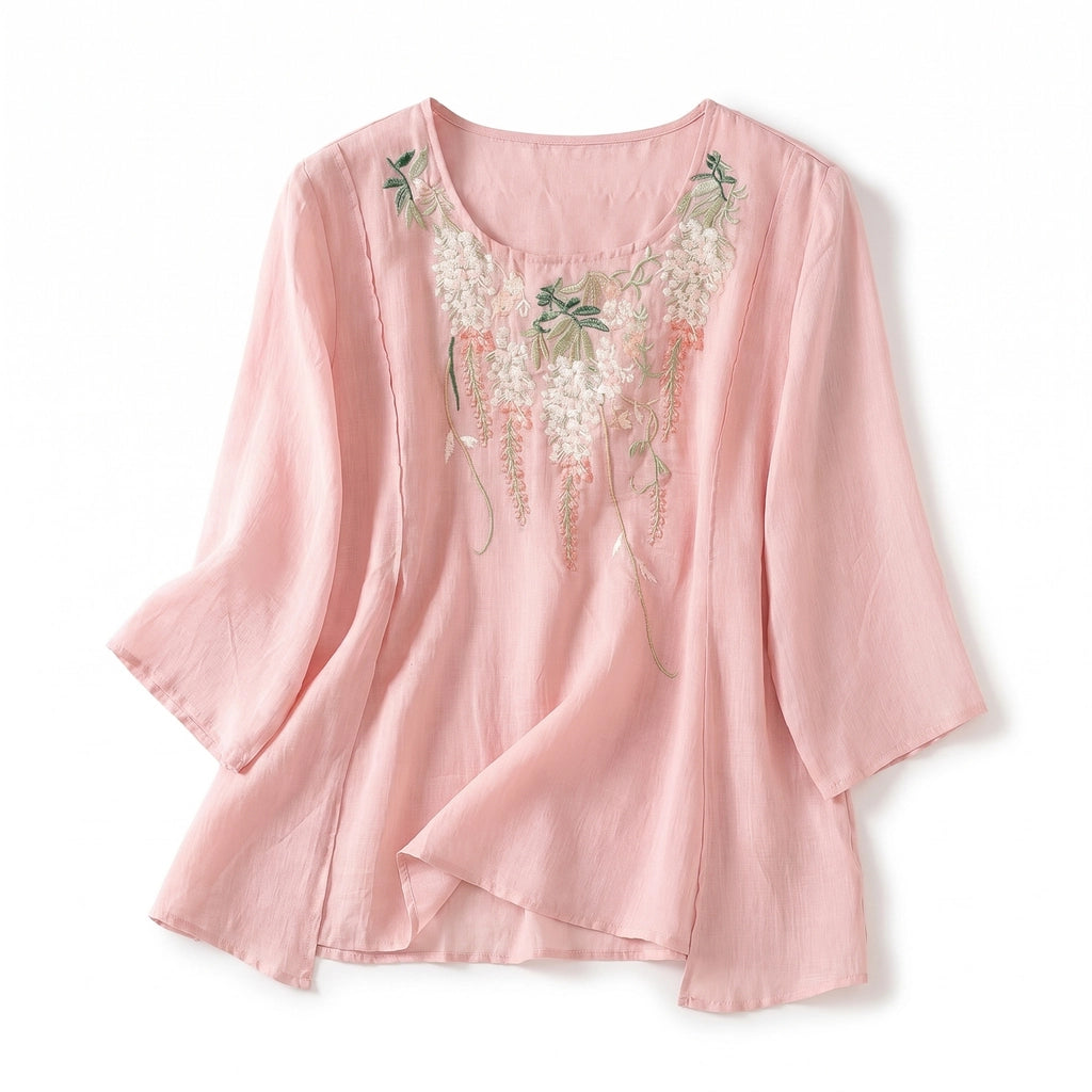Model wearing lightweight embroidered top