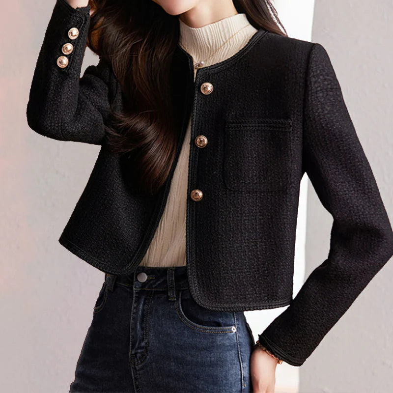 Short blazer detail showing chest pockets