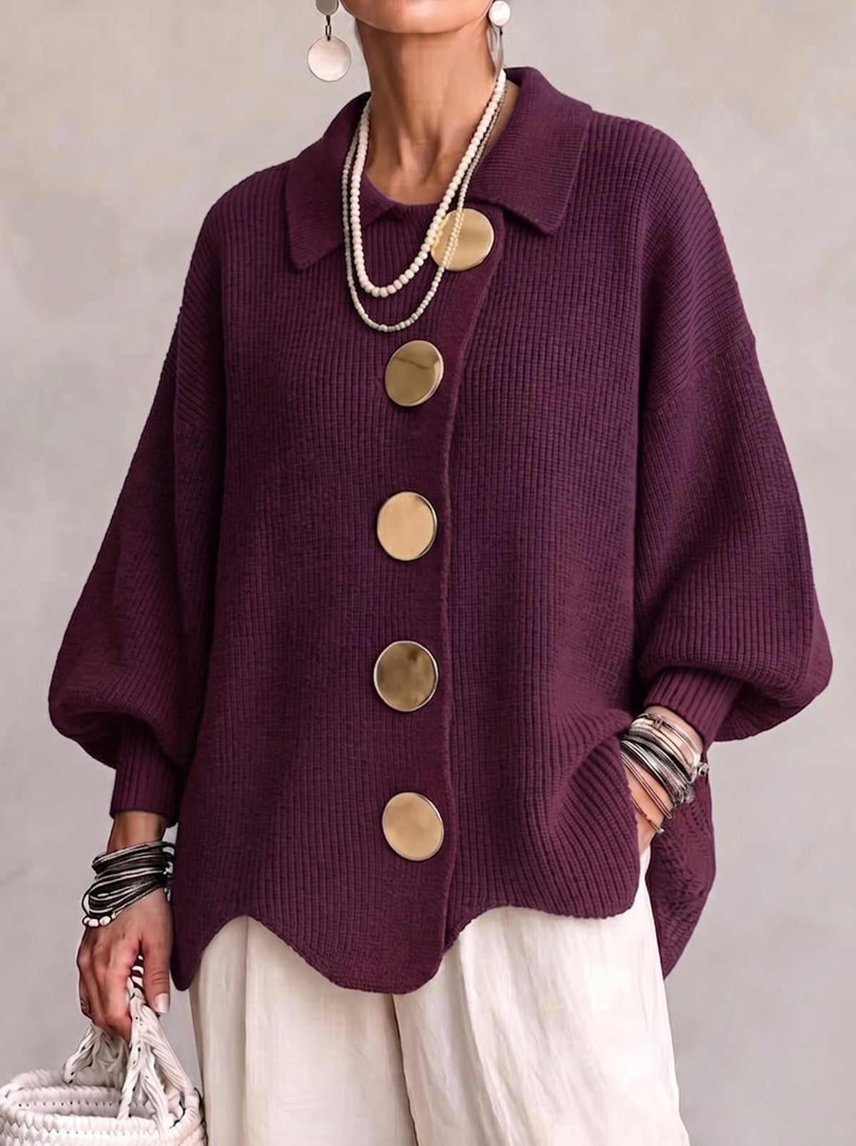 Gold-tone button detail on cardigan