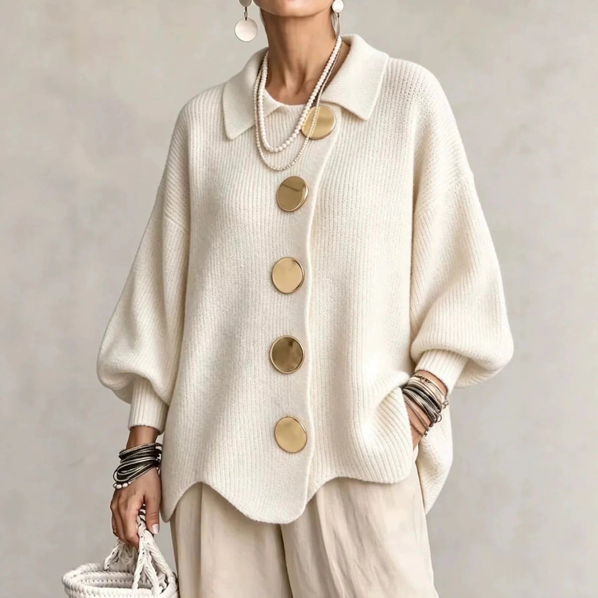 Oversized knit cardigan worn outdoors