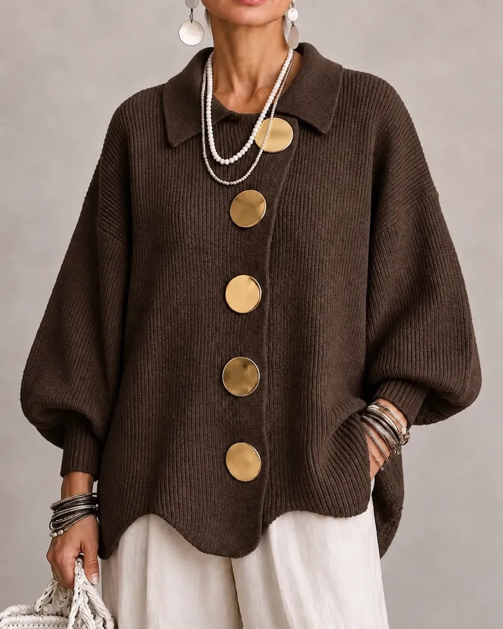Cardigan draped over shoulders