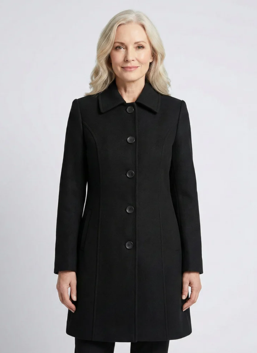 Woman wearing a tailored coat with front buttons