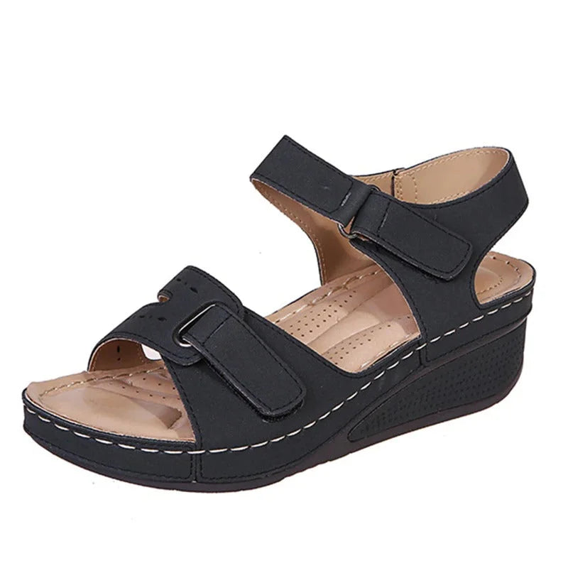 Pair of sandals on plain background