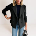 Double-breasted blazer with knitted sleeves front view