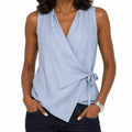 Woman wearing draped wrap blouse front view