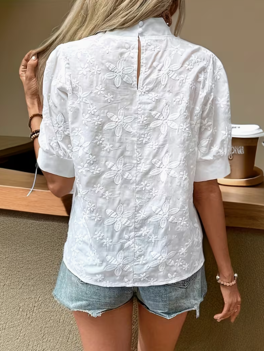 White embroidered blouse close up detail