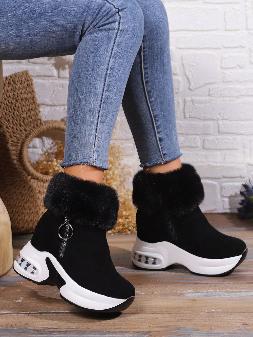 Side view of black platform ankle boots
