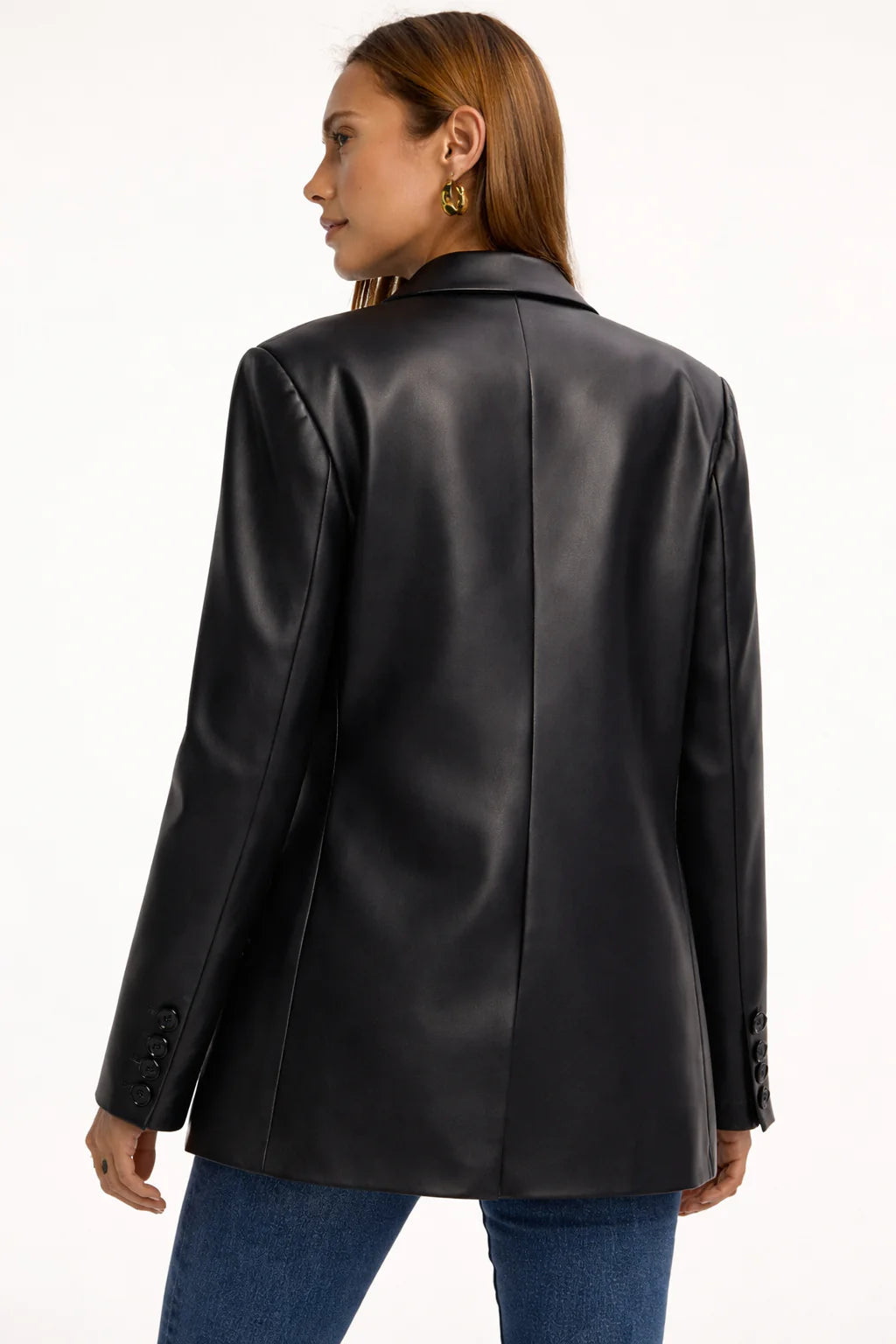 Close-up of black faux leather blazer fabric