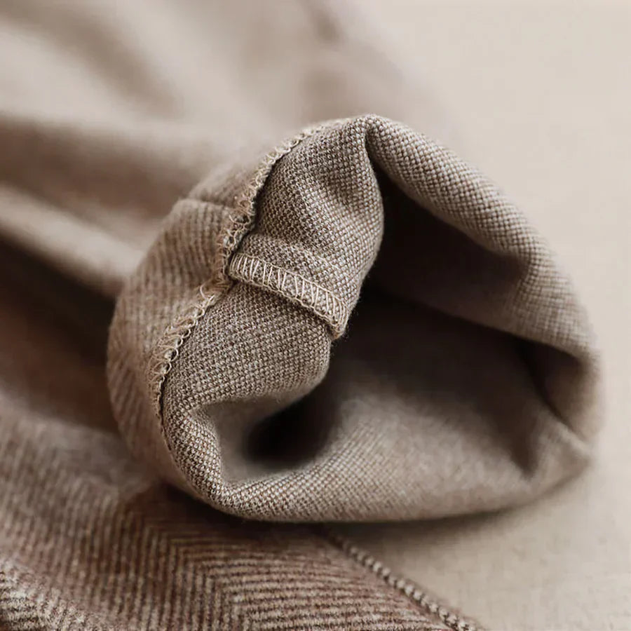 High-waist trousers styled with knit jumper
