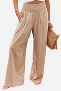 Woman wearing high-waisted palazzo trousers front view