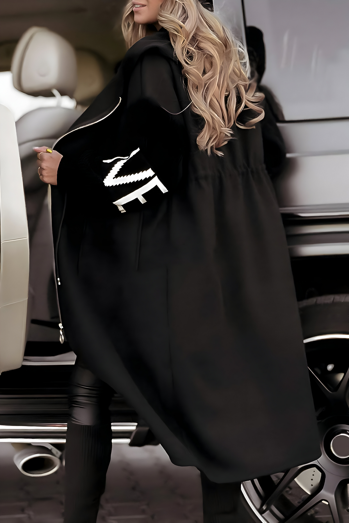 Woman wearing jacket in black colourway