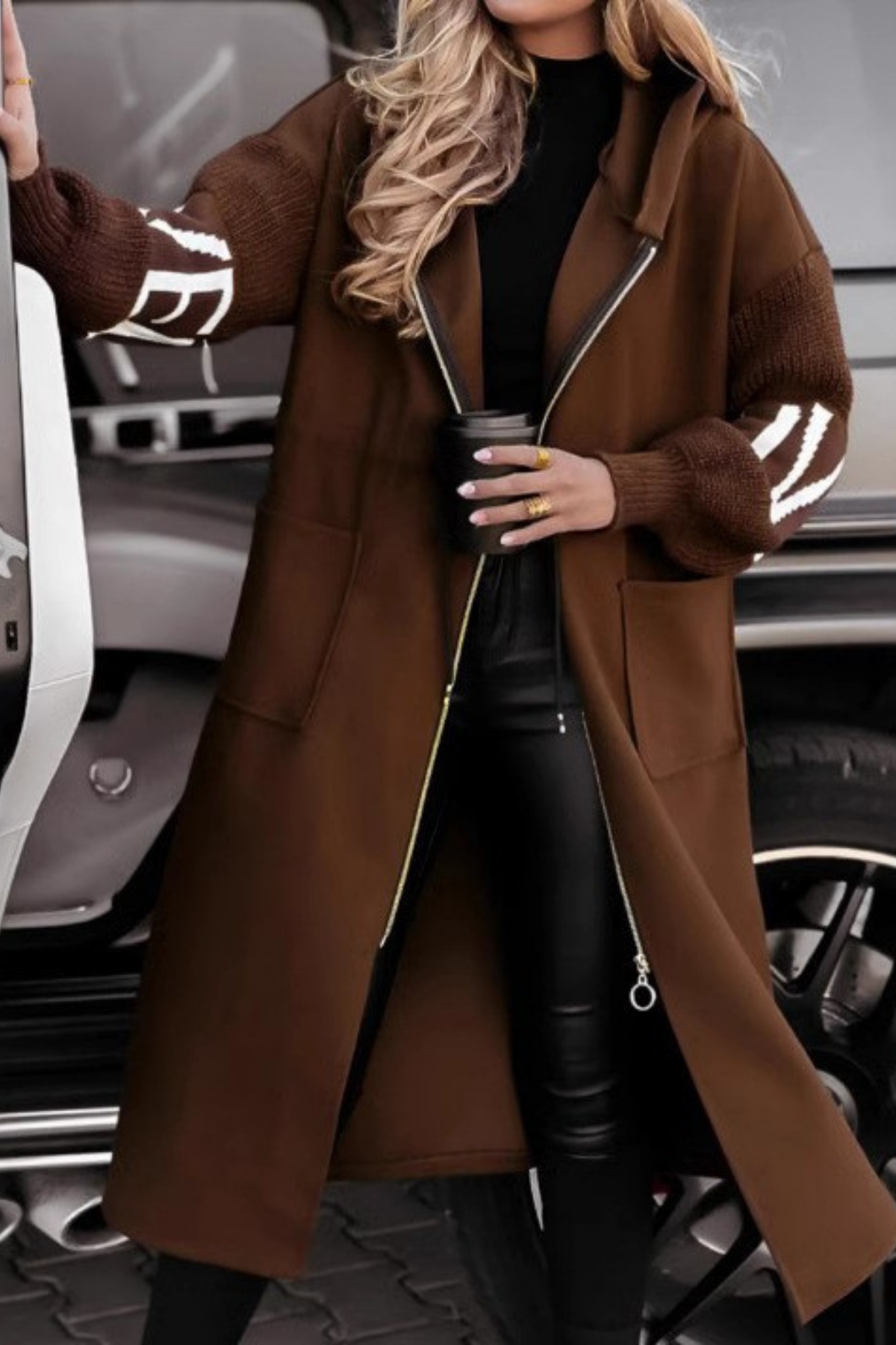 Front view of hooded jacket with knitted sleeves