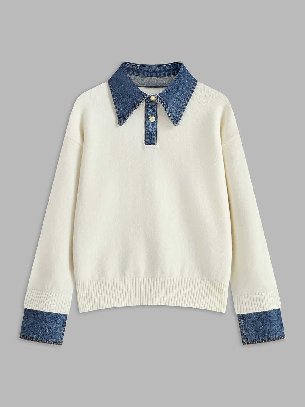 Knit jumper paired with trousers styling shot