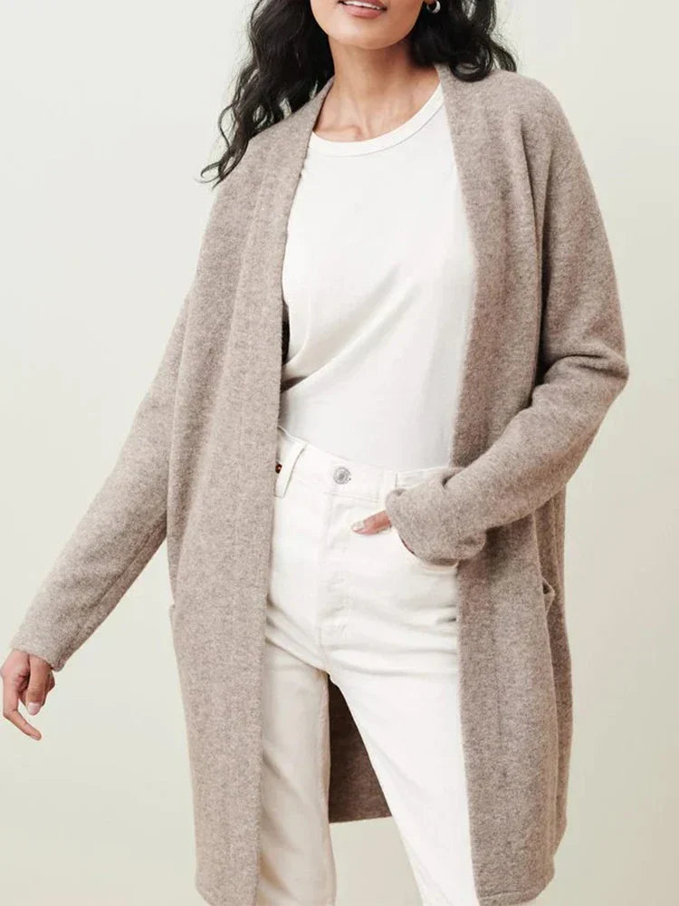 Cardigan worn over blouse