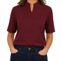 Woman wearing mandarin collar top front view