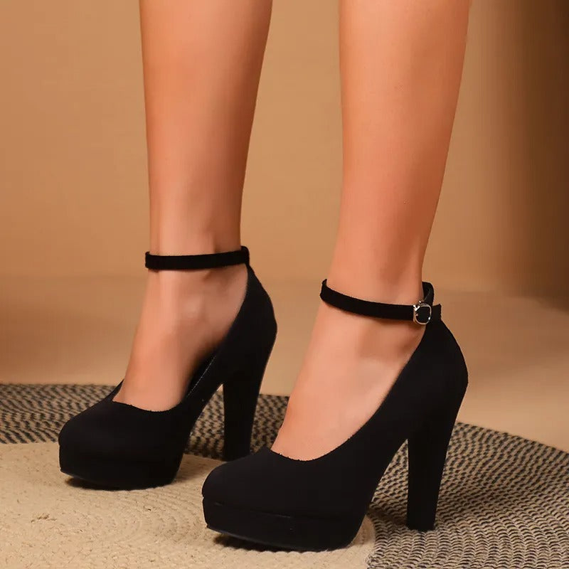 Black heeled pumps side view with ankle strap