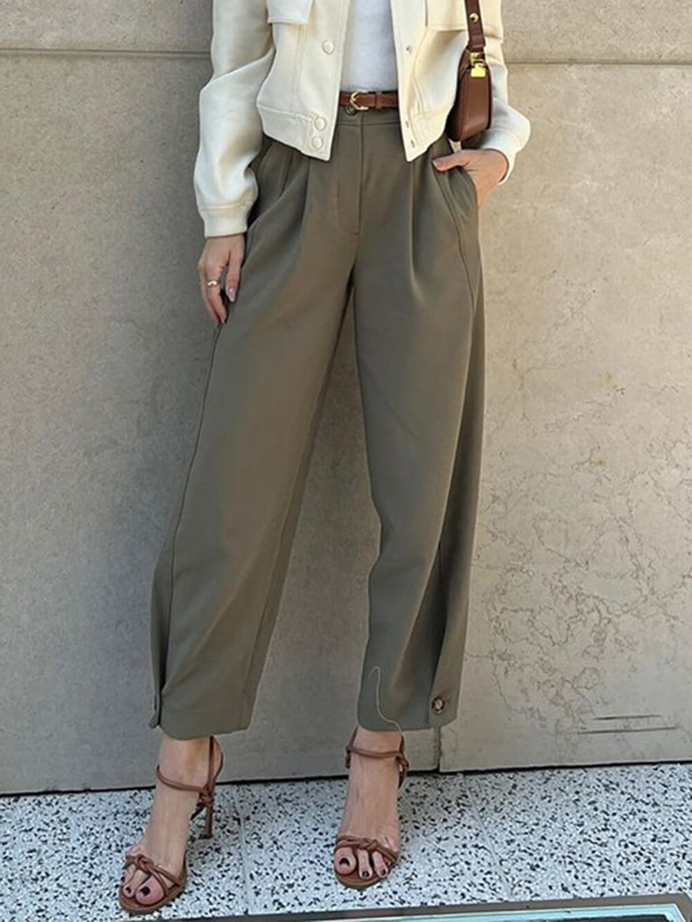 Close-up of front pleats on trousers