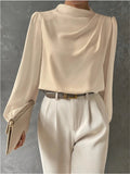 Woman wearing relaxed fit blouse front view
