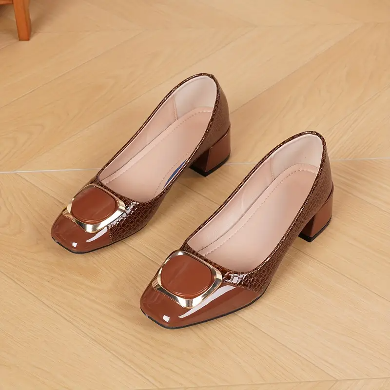 Block heel pumps worn on foot