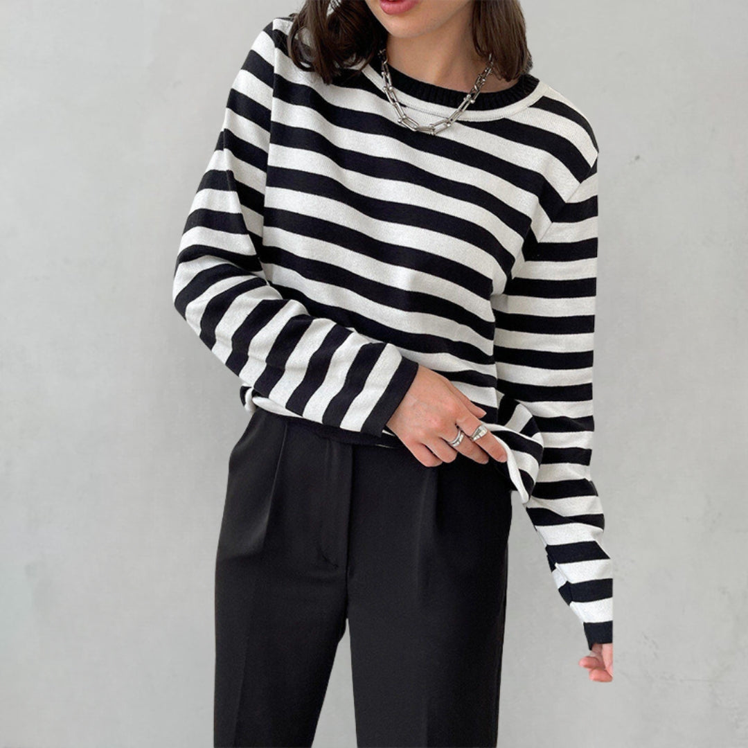 Striped jumper worn casually outdoors