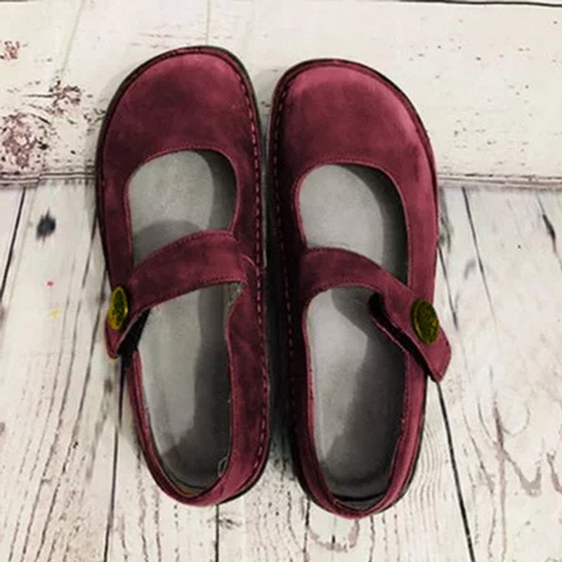 Brown suede Mary Jane shoes side view