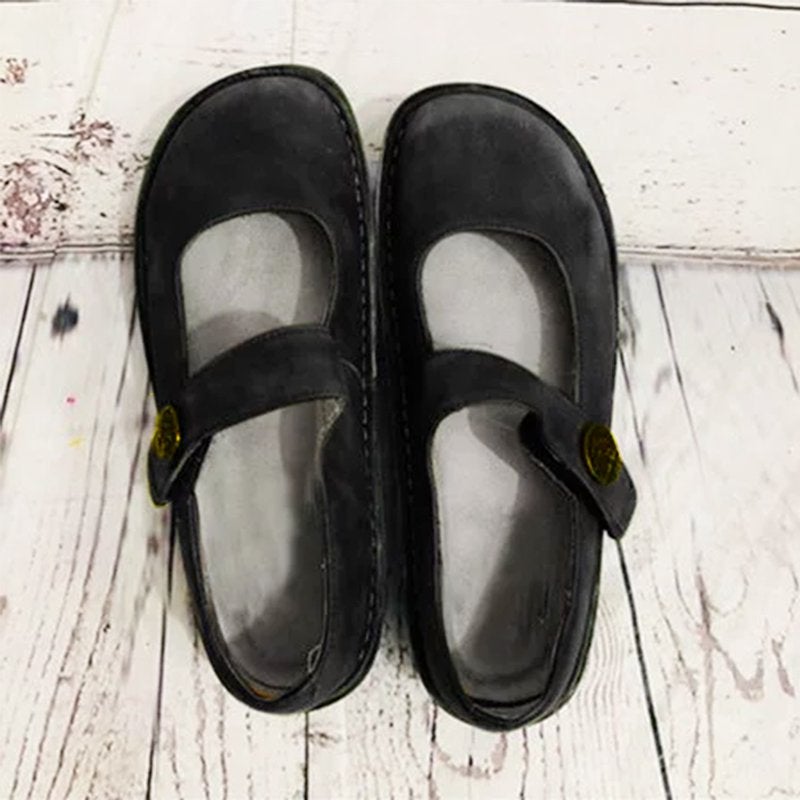 Black suede Mary Jane shoes close-up