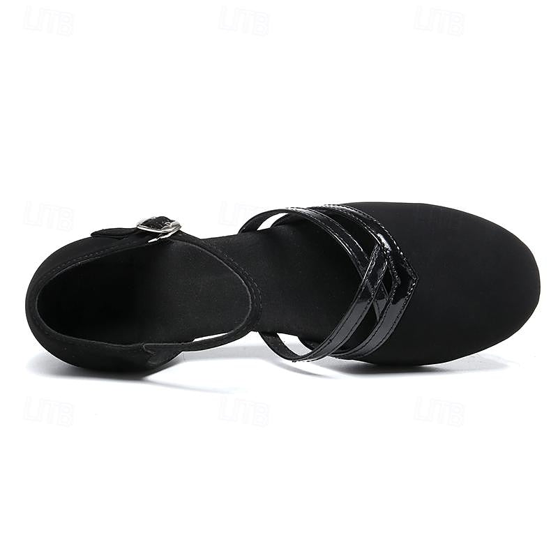 Pair of ballroom dance shoes on floor