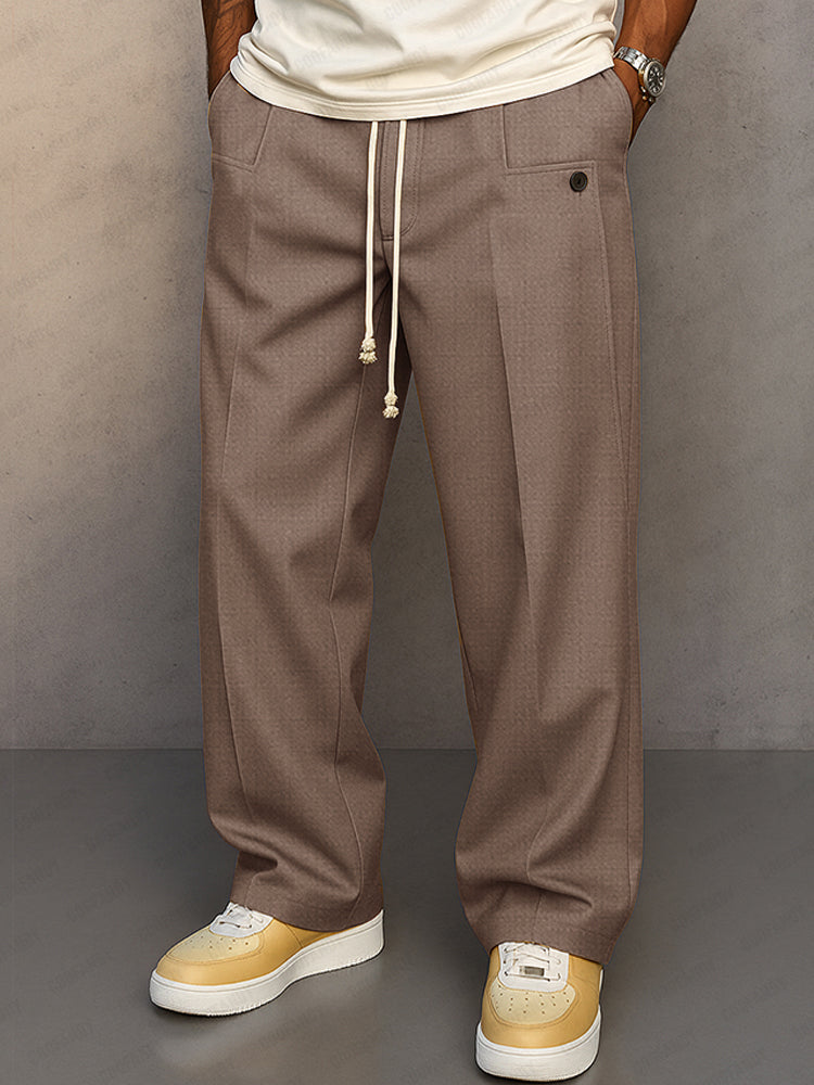Model walking in soft flowing trousers