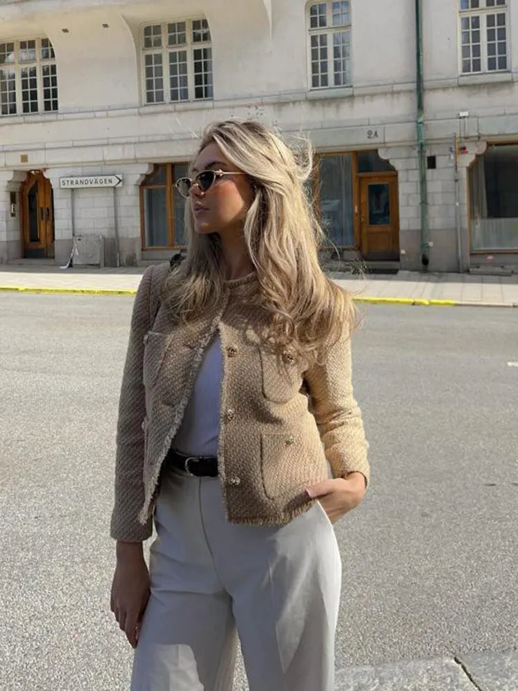 Tailored short blazer styled with skirt