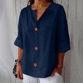 Woman wearing V-neck short sleeve blouse front view