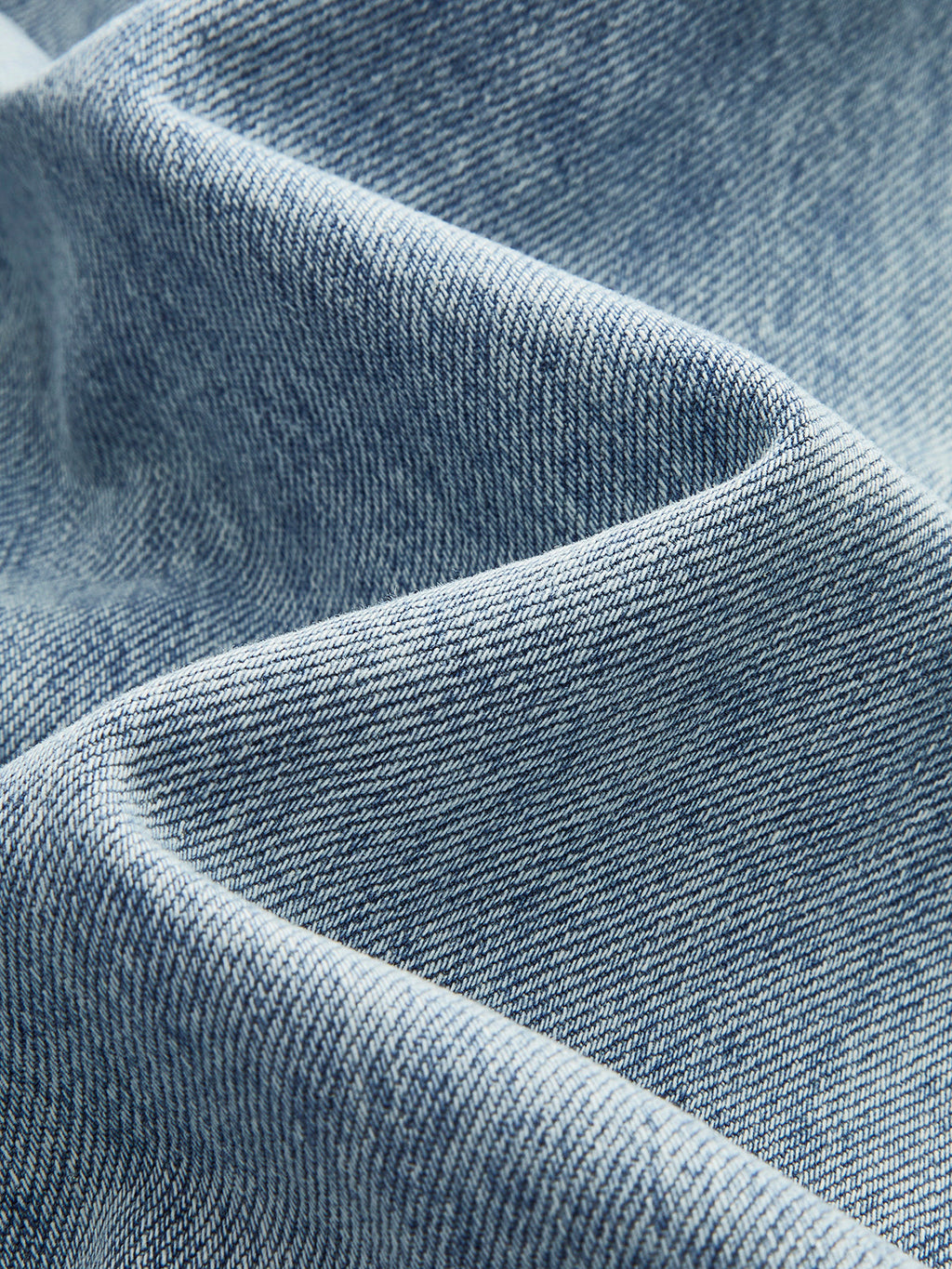 Side view of wide-leg denim jeans