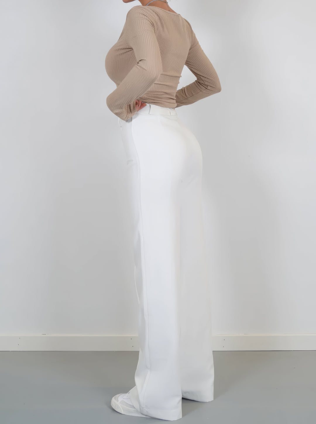 Wide-leg trousers close-up detail