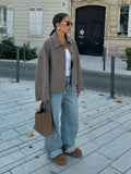 Woman wearing wool coat with button closure