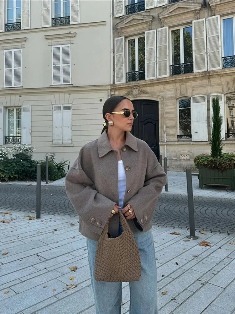 Wool coat side view showing straight silhouette